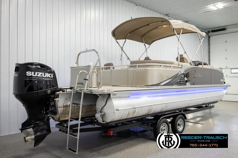 Slide: The Image of 2022 Avalon LSZ QL pontoon boat with Suzuki outboard motor in showroom. - 6