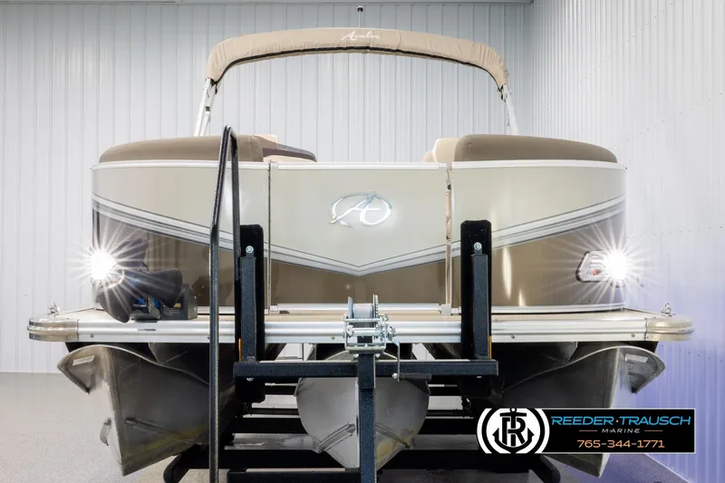 Slide: The Image of 2022 Avalon LSZ QL pontoon boat on trailer in indoor storage facility. - 8