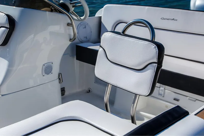 Slide: The Image of Manufacturer Provided Image: 2025 Walker Bay Generation 525 DLX boat interior with white seating and sleek design. - 7
