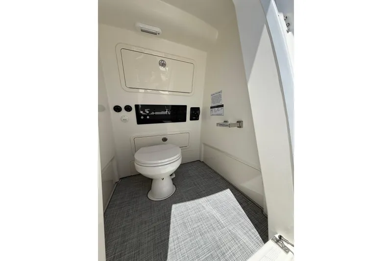 Slide: The Image of Interior of 2026 World Cat 265 CC-X boat bathroom, featuring modern amenities and sleek design. - 10
