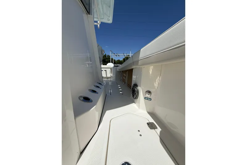 Slide: The Image of 2026 World Cat 265 CC-X boat interior, featuring sleek white design and modern fixtures. - 14