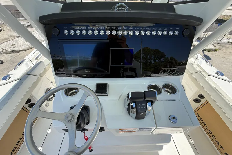 Slide: The Image of Helm of 2026 World Cat 265 CC-X boat with modern controls and steering wheel. - 16