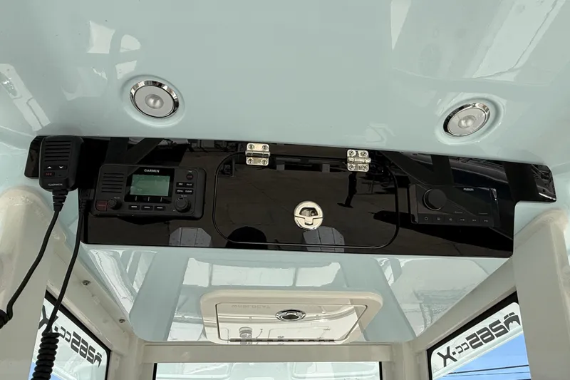 Slide: The Image of 2026 World Cat 265 CC-X boat dashboard with Garmin and Fusion electronics. - 17