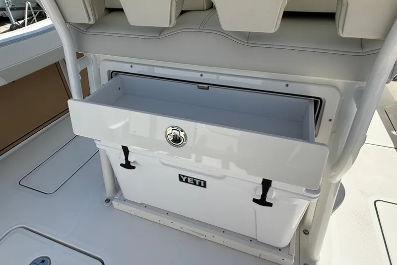 Slide: The Image of 2026 World Cat 265 CC-X boat with integrated Yeti cooler storage. - 19