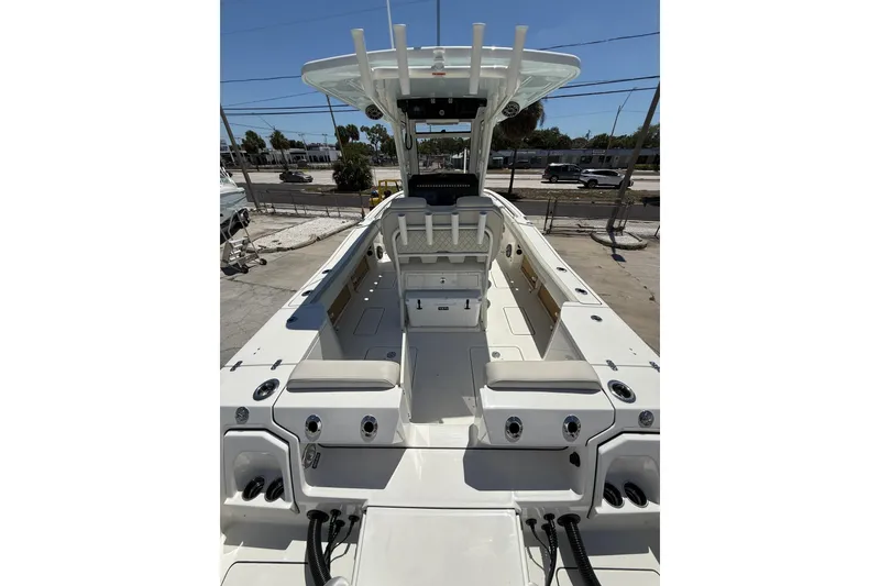 Slide: The Image of 2026 World Cat 265 CC-X boat interior with seating and helm station. - 23