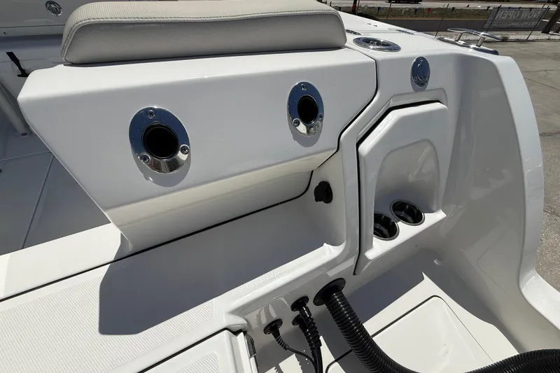 Slide: The Image of 2026 World Cat 265 CC-X boat interior with rod holders and seating. - 24