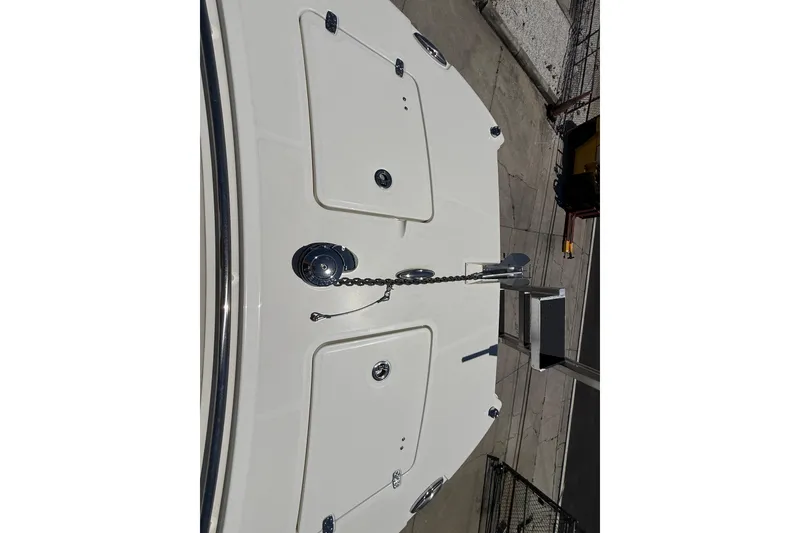 Slide: The Image of 2026 World Cat 265 CC-X boat deck with anchor chain and storage compartments. - 6