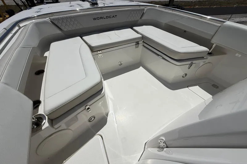 Slide: The Image of 2026 World Cat 265 CC-X boat interior with cushioned seating and storage compartments. - 8