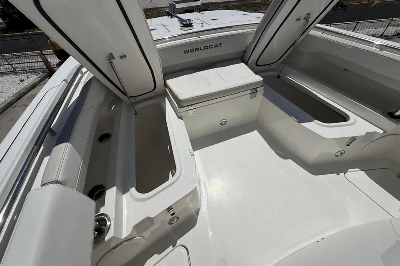 Slide: The Image of 2026 World Cat 265 CC-X boat interior with open storage compartments and seating. - 9
