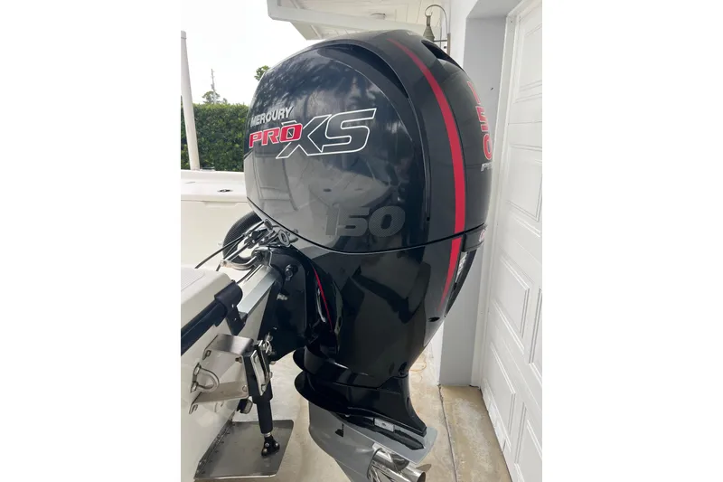 Slide: The Image of Mercury Pro XS 150 outboard motor on 2005 Mako 2101 Inshore boat. - 18
