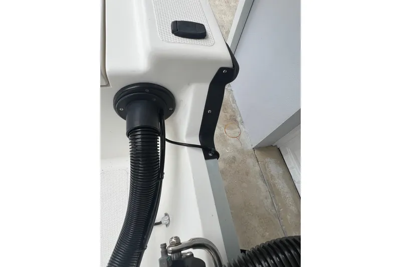 Slide: The Image of 2005 Mako 2101 Inshore boat detail showing wiring and hose connections. - 25