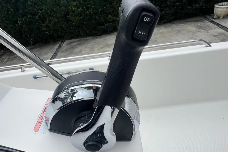 Slide: The Image of Boat throttle control on 2005 Mako 2101 Inshore, featuring "UP" and "DN" buttons. - 27