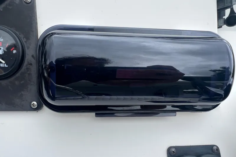 Slide: The Image of Instrument panel of a 2005 Mako 2101 Inshore boat with fuel gauge. - 31