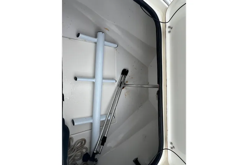 Slide: The Image of Storage compartment of 2005 Mako 2101 Inshore boat with ladder and equipment. - 35