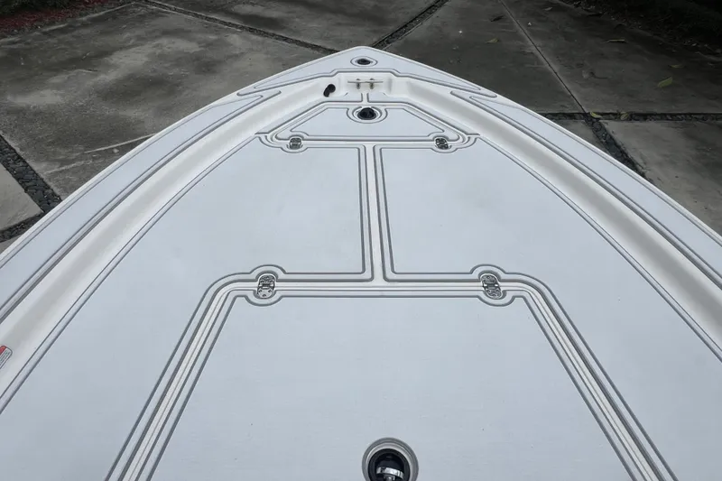 Slide: The Image of Bow of 2005 Mako 2101 Inshore boat with clean deck design. - 36