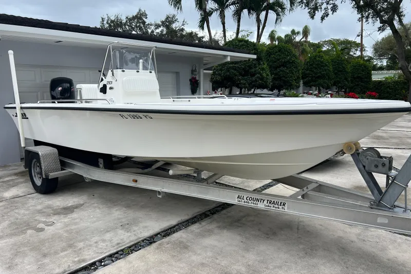 Slide: The Image of 2005 Mako 2101 Inshore boat on trailer, parked in driveway. - 4