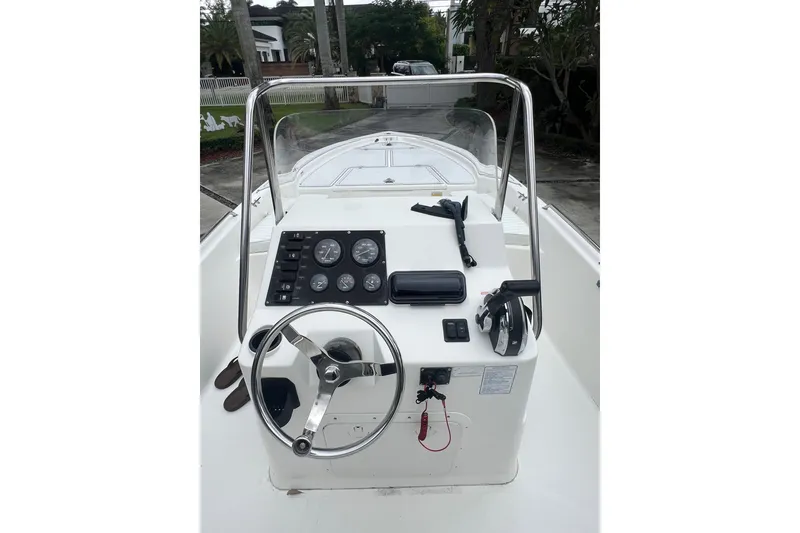 Slide: The Image of 2005 Mako 2101 Inshore boat console with steering wheel and instrument panel. - 43