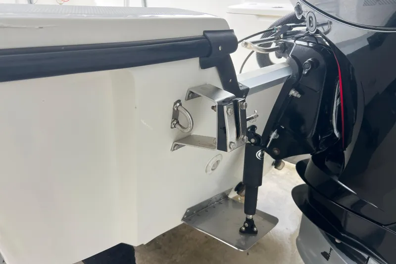 Slide: The Image of 2005 Mako 2101 Inshore boat transom with motor mount and trim tab. - 47
