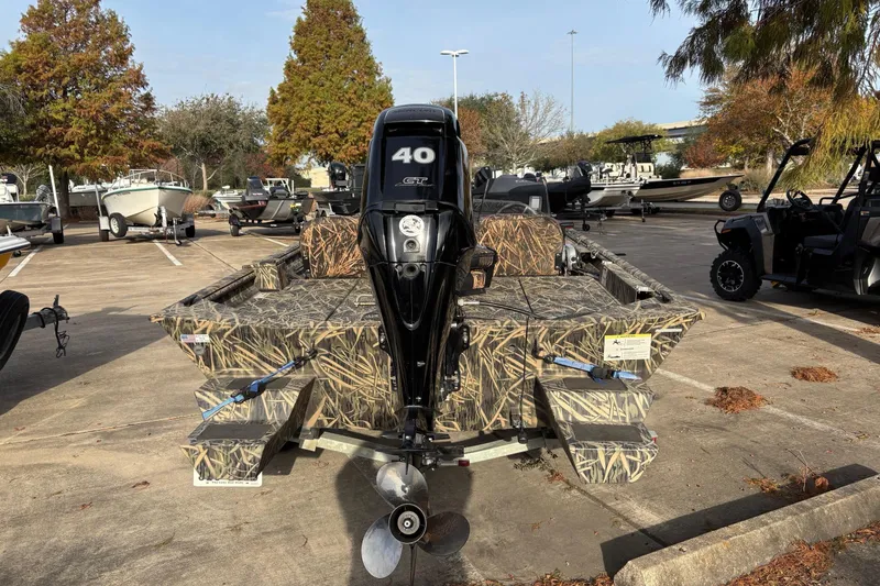 Slide: The Image of 2017 Lowe Roughneck 1860SC boat with camouflage design and 40 HP outboard motor. - 5