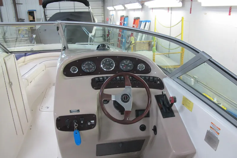 Slide: The Image of 1999 Chaparral 2830 SS boat dashboard with steering wheel and instrument panel. - 7
