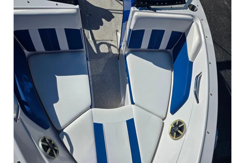 Slide: The Image of 2013 Glastron GT 205 boat interior with blue and white seating. - 20