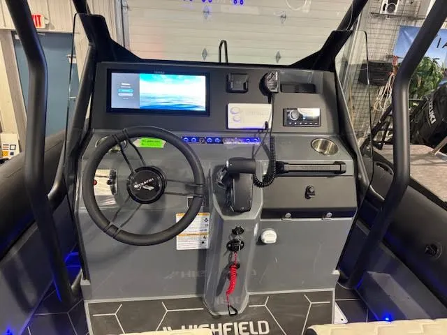Slide: The Image of Interior view of Highfield ADV7 2026 boat cockpit with controls and electronics. - 12