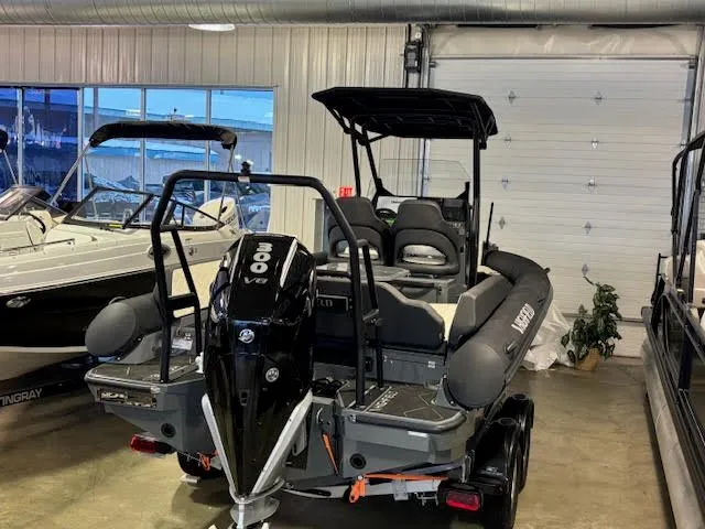 Slide: The Image of 2026 Highfield ADV7 boat with 300 HP engine in a storage facility. - 3