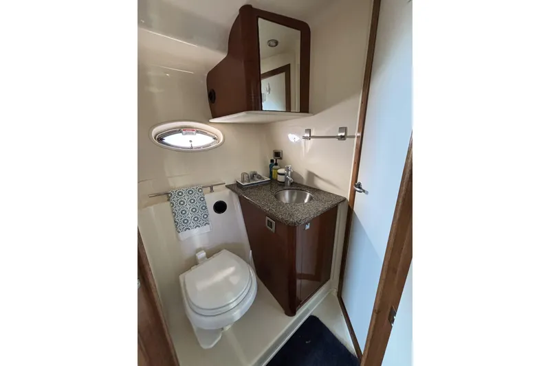Slide: The Image of Bathroom interior of 2008 Sea Ray 38 Sundancer yacht with sink and toilet. - 12