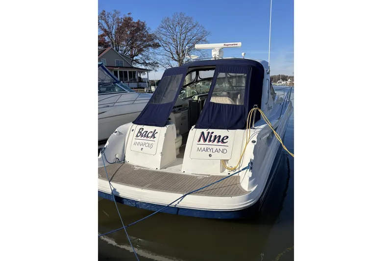 Slide: The Image of 2008 Sea Ray 38 Sundancer docked in Annapolis, Maryland, with blue covers. - 13
