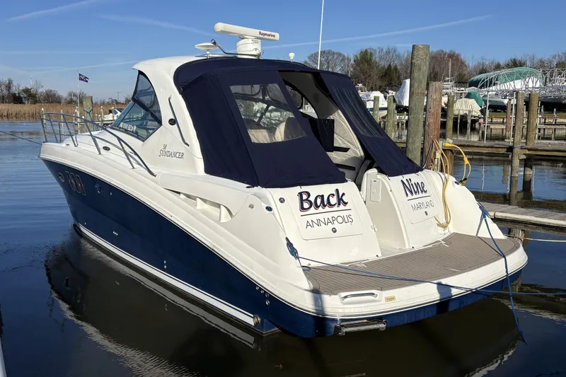 Slide: The Image of 2008 Sea Ray 38 Sundancer docked, featuring blue and white design, Annapolis, Maryland. - 2