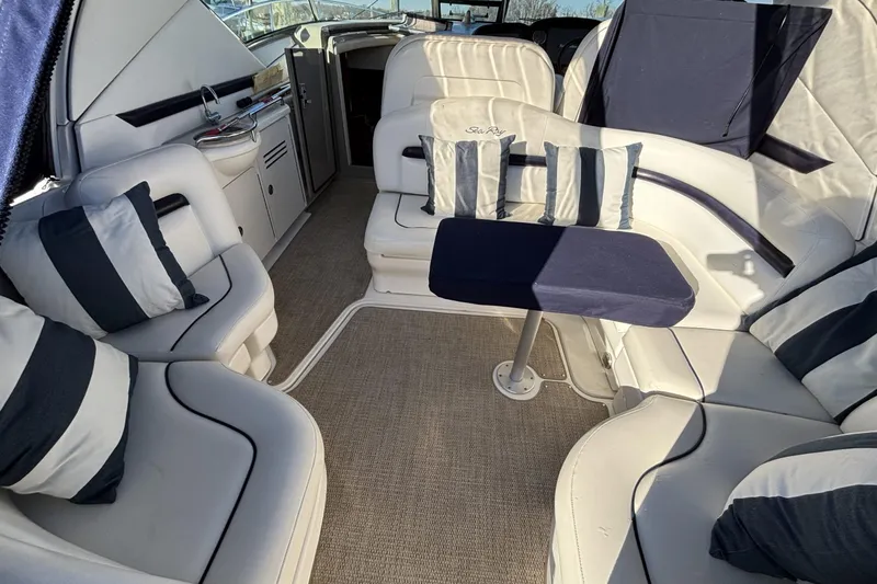 Slide: The Image of Luxurious interior of 2008 Sea Ray 38 Sundancer yacht with plush seating and striped cushions. - 3