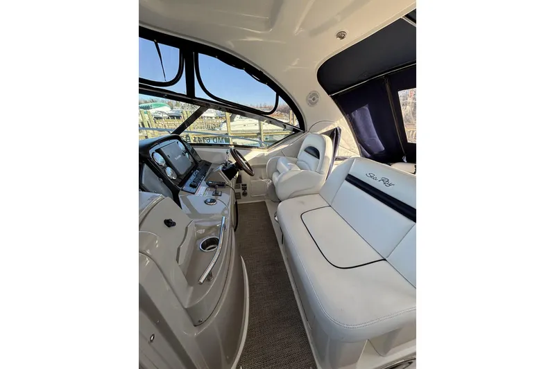 Slide: The Image of Interior of 2008 Sea Ray 38 Sundancer yacht with luxurious seating and helm. - 6