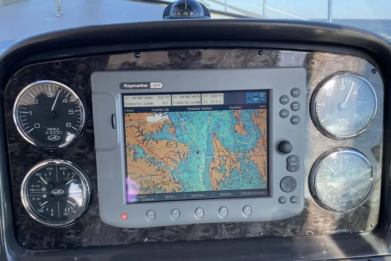 Slide: The Image of Dashboard of 2008 Sea Ray 38 Sundancer with navigation system and gauges. - 7