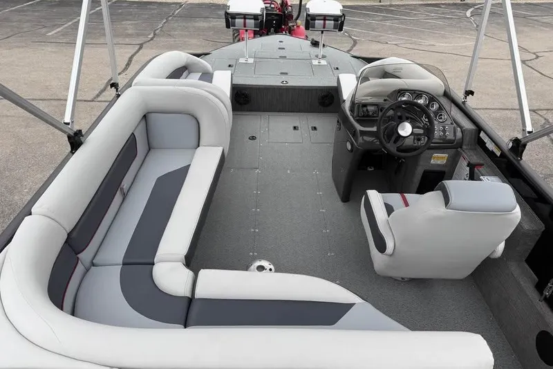 Slide: The Image of 2026 Lowe Sport Deck 224 boat interior with seating and steering console. - 10