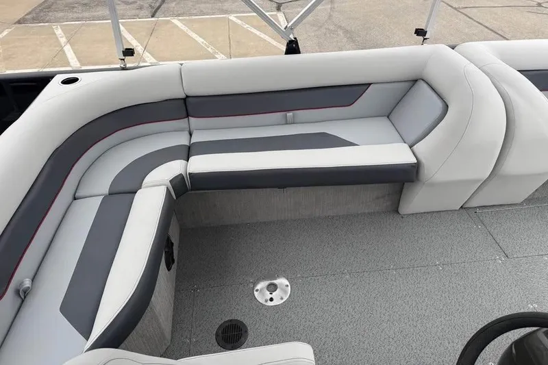 Slide: The Image of 2026 Lowe Sport Deck 224 boat interior with gray and white cushioned seating. - 13