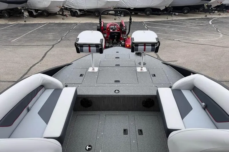 Slide: The Image of 2026 Lowe Sport Deck 224 boat interior with seating and steering console. - 14