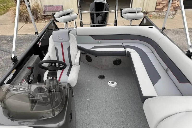 Slide: The Image of 2026 Lowe Sport Deck 224 interior with modern seating and steering console. - 17