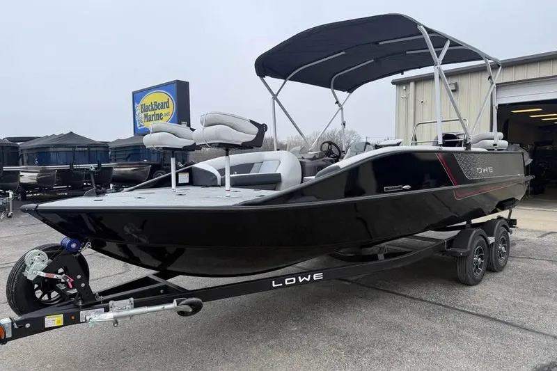 Slide: The Image of 2026 Lowe Sport Deck 224 boat on trailer at BlackBeard Marine dealership. - 4