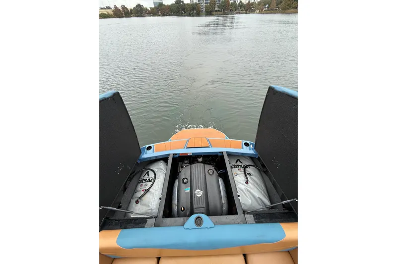 Slide: The Image of 2021 Axis T23 boat engine compartment with FatSac ballast bags on a calm lake. - 15
