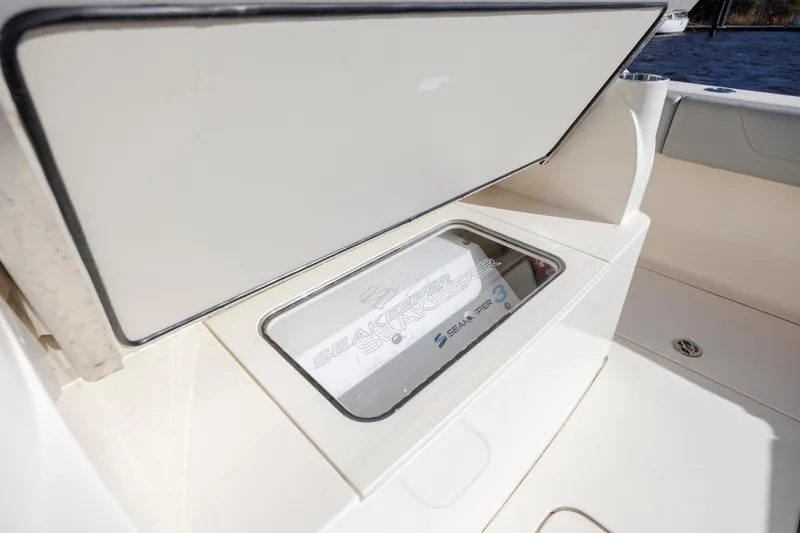 Slide: The Image of 2019 Scout 355 LXF boat featuring Seakeeper 3 stabilization system. - 18