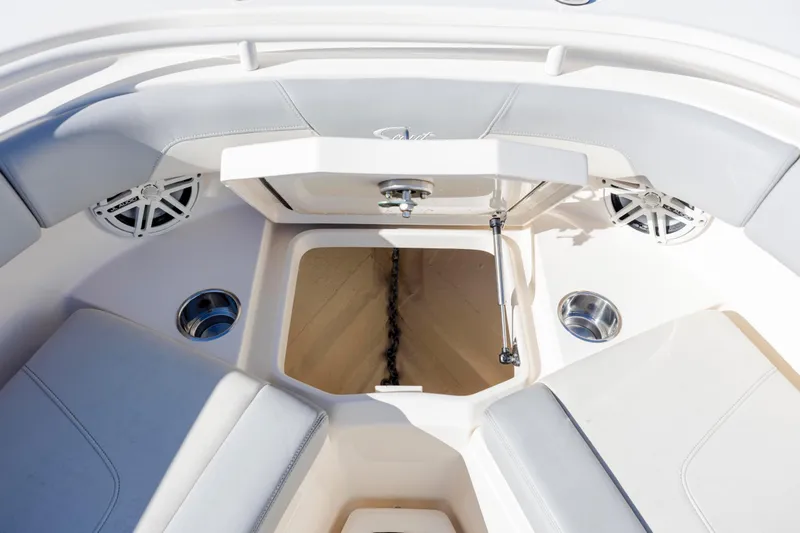 Slide: The Image of 2019 Scout 355 LXF boat interior with anchor storage and seating area. - 32
