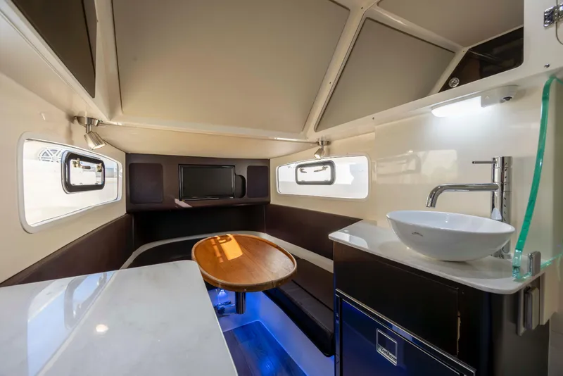 Slide: The Image of Luxurious interior of 2019 Scout 355 LXF boat with modern amenities and elegant design. - 38