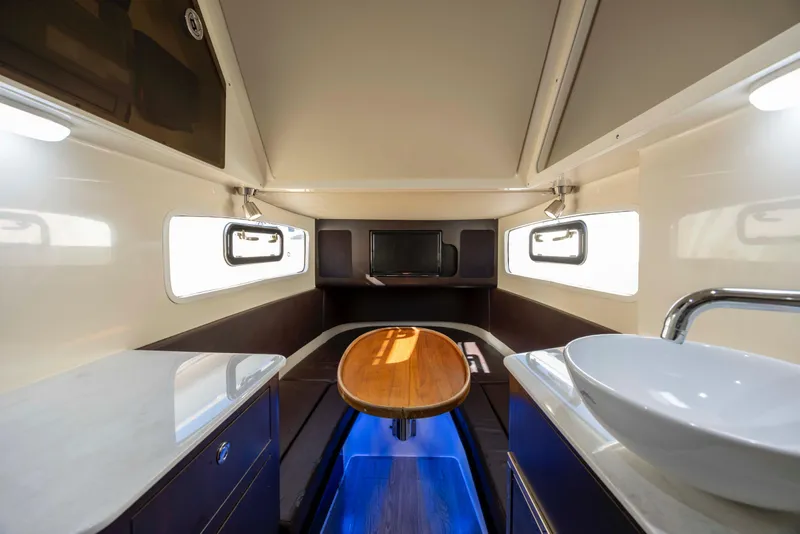 Slide: The Image of Luxurious interior of 2019 Scout 355 LXF boat with modern amenities and elegant design. - 39