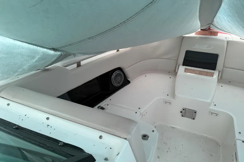 Slide: The Image of Interior of a 2016 Boston Whaler 270 Vantage boat, featuring seating and speaker. - 17