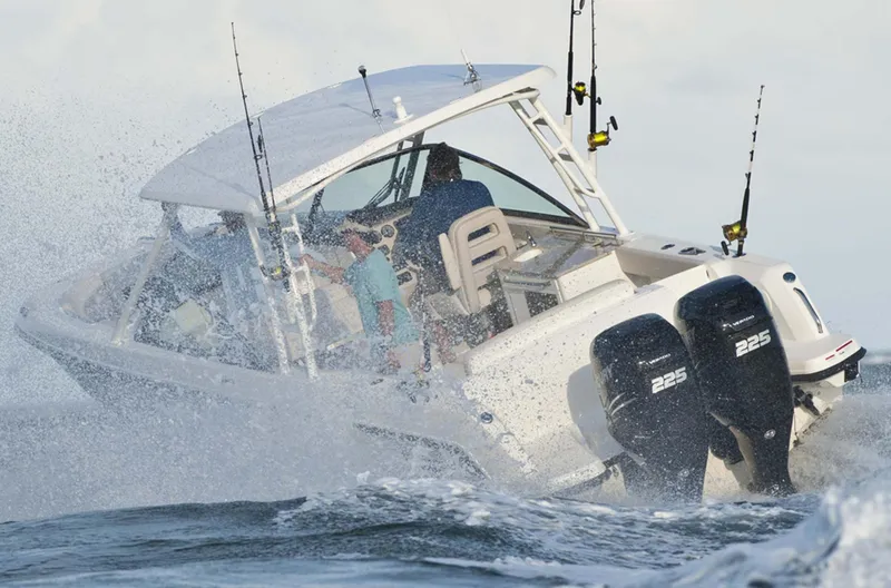 Slide: The Image of Manufacturer Provided Image: 2016 Boston Whaler 270 Vantage navigating rough waters with dual 225 engines. - 23