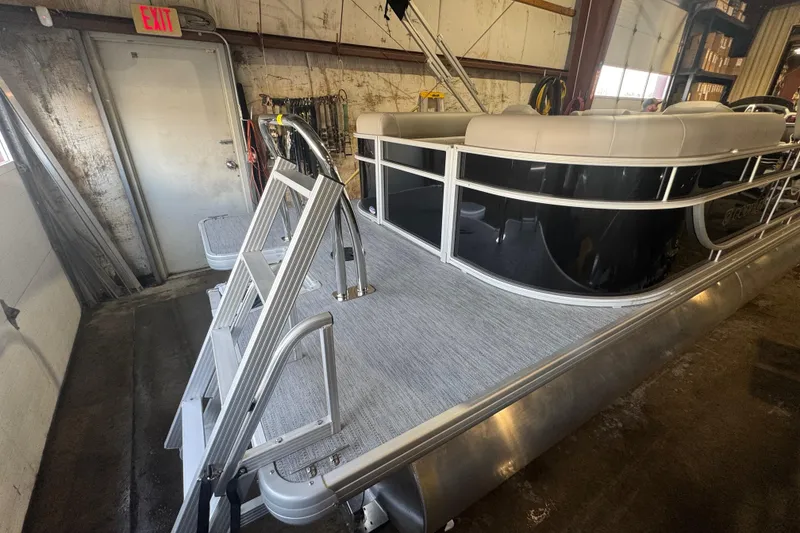 Slide: The Image of 2026 Godfrey Xperience 2286 SBX pontoon boat in a warehouse setting. - 12