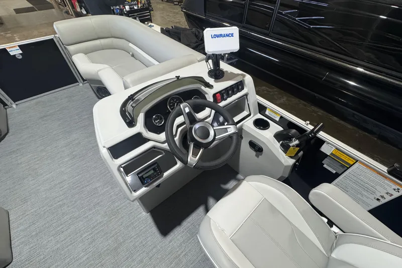 Slide: The Image of 2026 Godfrey Xperience 2286 SBX boat interior with steering console and seating. - 6