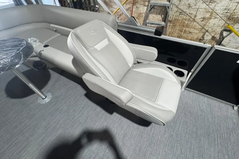 Slide: The Image of Luxurious seating on 2026 Godfrey Xperience 2286 SBX pontoon boat, featuring plush upholstery and cup holders. - 8