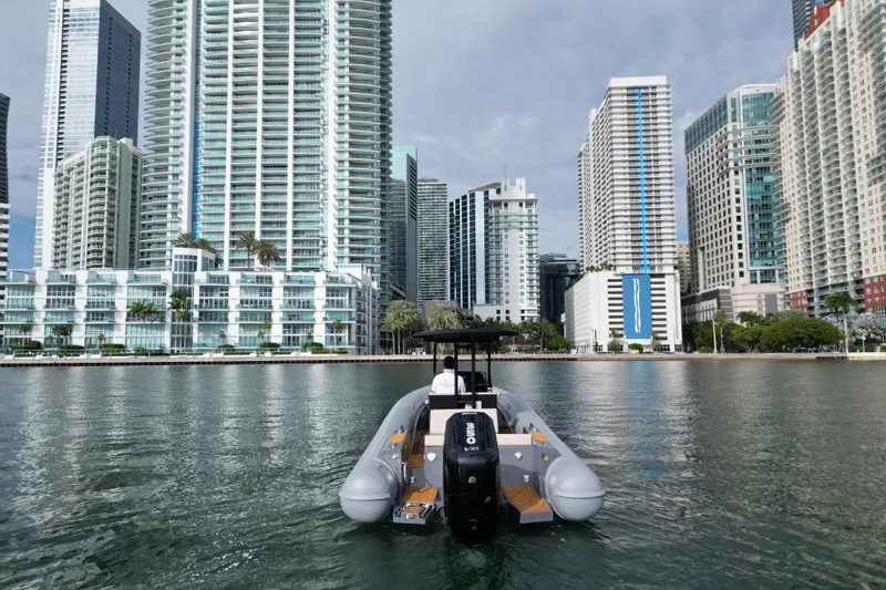 Slide: The Image of 2026 Northstar Orion 8 boat on water with city skyscrapers in background. - 10