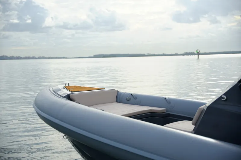 Slide: The Image of 2026 Northstar Orion 8 boat on calm water under cloudy sky. - 12